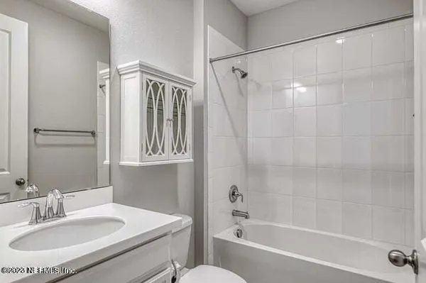 a bathroom with a sink and a bathtub