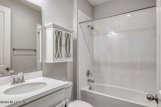 a bathroom with a sink and a bathtub