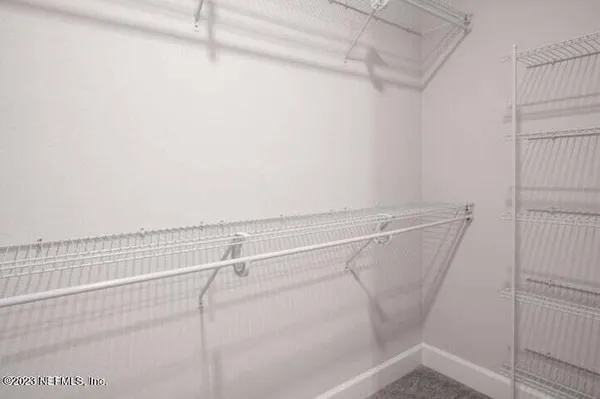a view of a room with racks on the wall