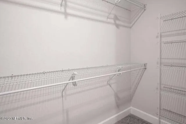 a view of a room with racks on the wall
