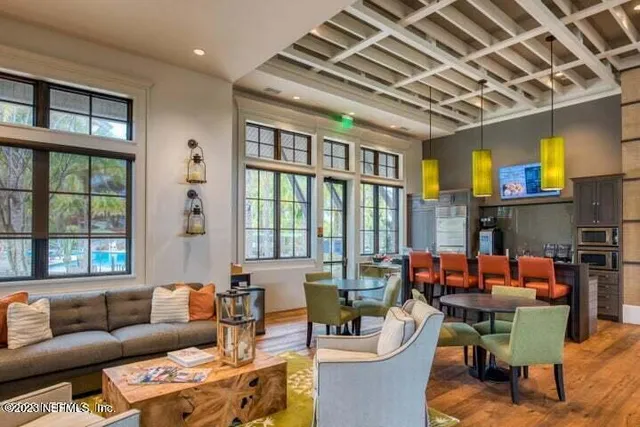 a living room with furniture or outdoor view and a large window