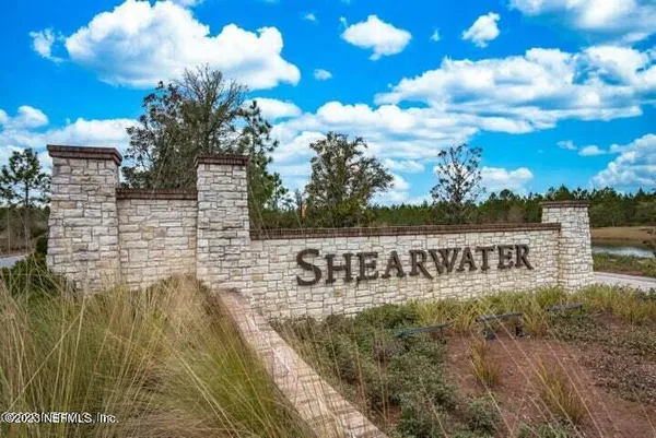 a view of ocean with a yard