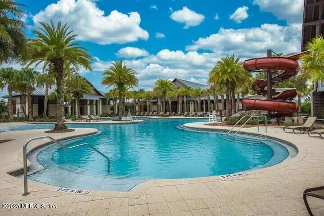 a view of a swimming pool with a patio