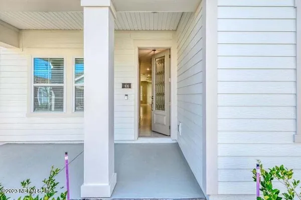a view of a house with a potted plant