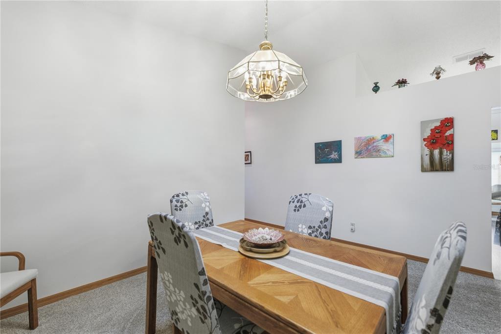 9049 Southwest 91st Circle Ocala, FL 34481 - Photo 12 of 37 a view of a dining room with furniture