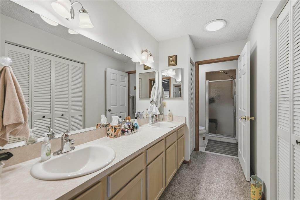 9049 Southwest 91st Circle Ocala, FL 34481 - Photo 23 of 37 a bathroom with a double vanity sink mirror and double