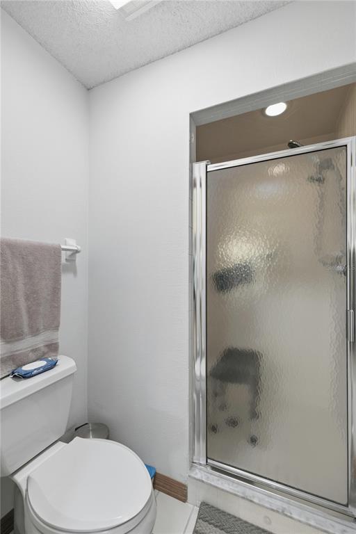 9049 Southwest 91st Circle Ocala, FL 34481 - Photo 25 of 37 a white toilet sitting next to a shower