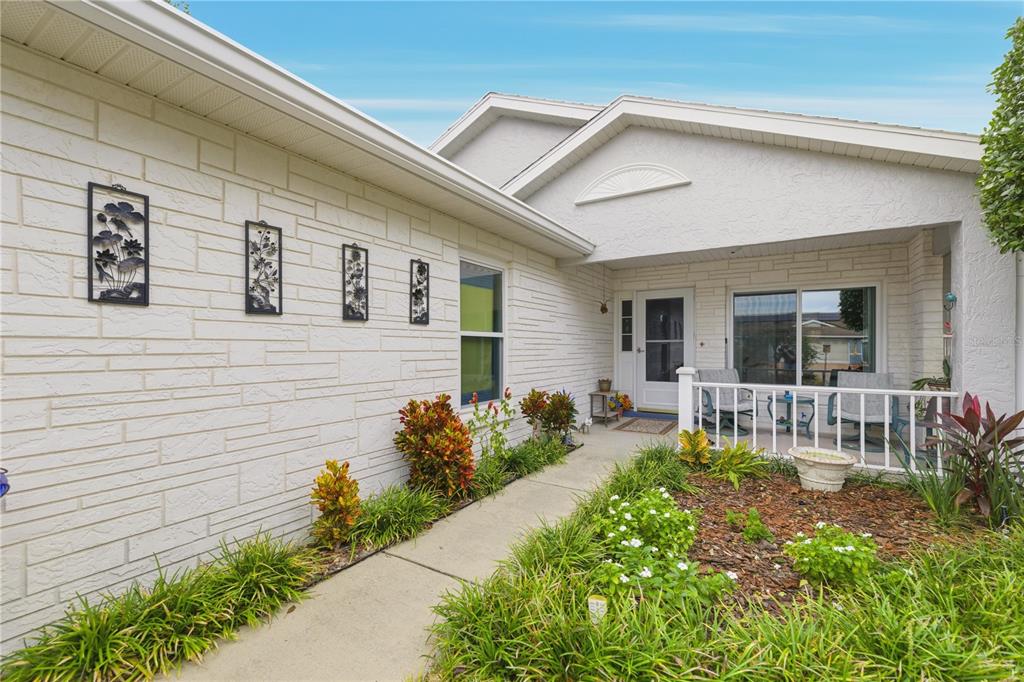 9049 Southwest 91st Circle Ocala, FL 34481 - Photo 3 of 37 a front view of house with yard