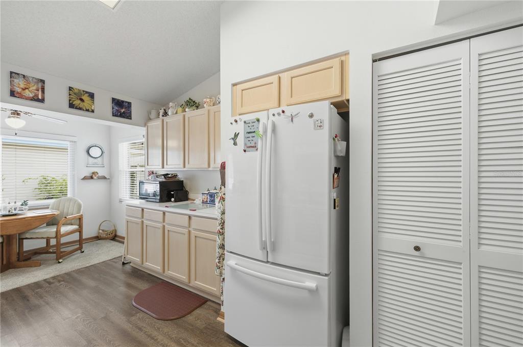 9049 Southwest 91st Circle Ocala, FL 34481 - Photo 9 of 37 a white refrigerator freezer sitting in a kitchen