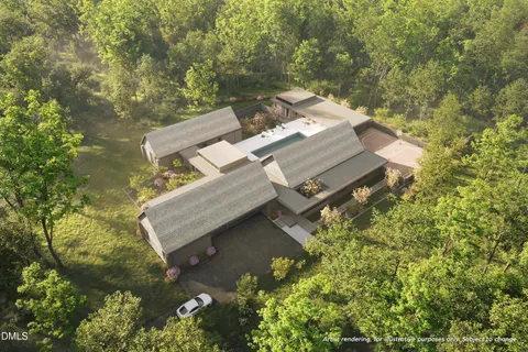 an aerial view of a house with a yard