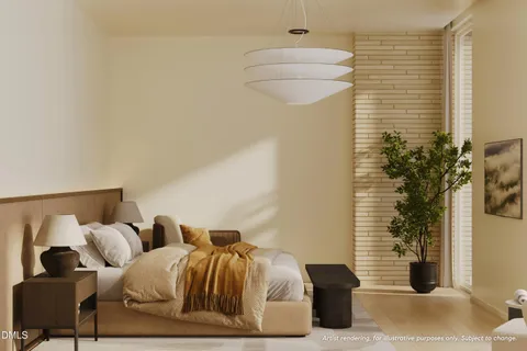 a bedroom with a bed and a potted plant