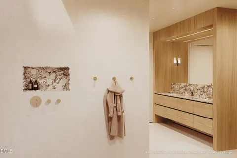 a bathroom with a double vanity sink mirror and toilet
