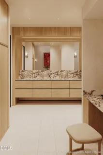 a room with a mirror a couch and a stove top oven