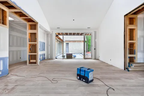 a front view of a house with a garden and plants