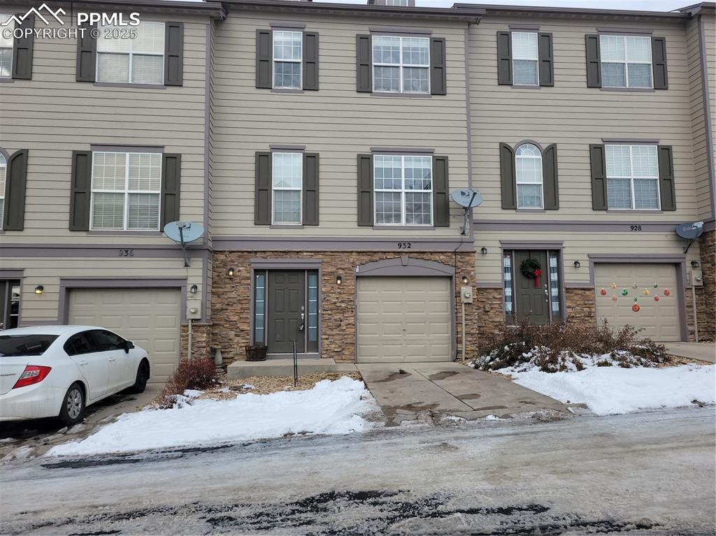 a view of a brick house with many windows