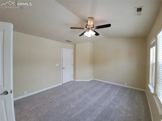 a view of empty room with windows
