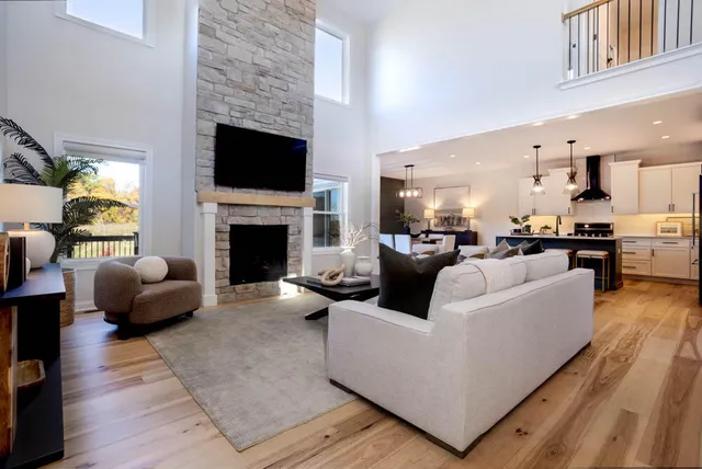 a living room with furniture fireplace and flat screen tv