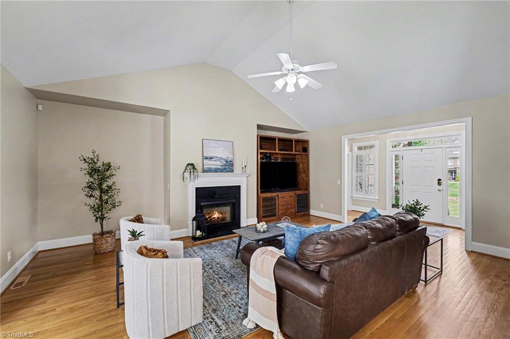 4257 Wayne Road Greensboro, NC 27407 - Photo 7 of 45 Living Room (The fireplace was not on for the photos. This photo was enhanced to show the fireplace on.)