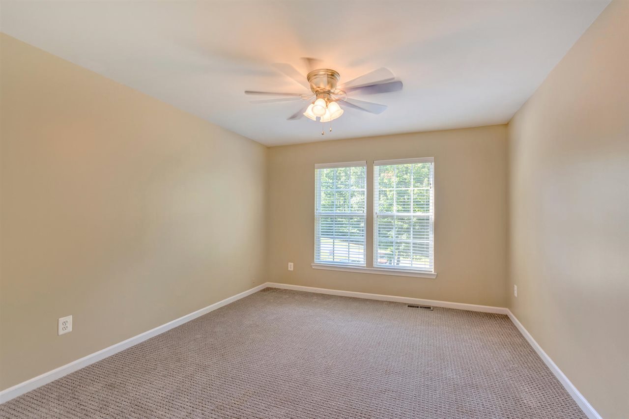 750 Reedy Creek Road Louisa, VA 23093 - Photo 26 of 41 an empty room with a window and a fan