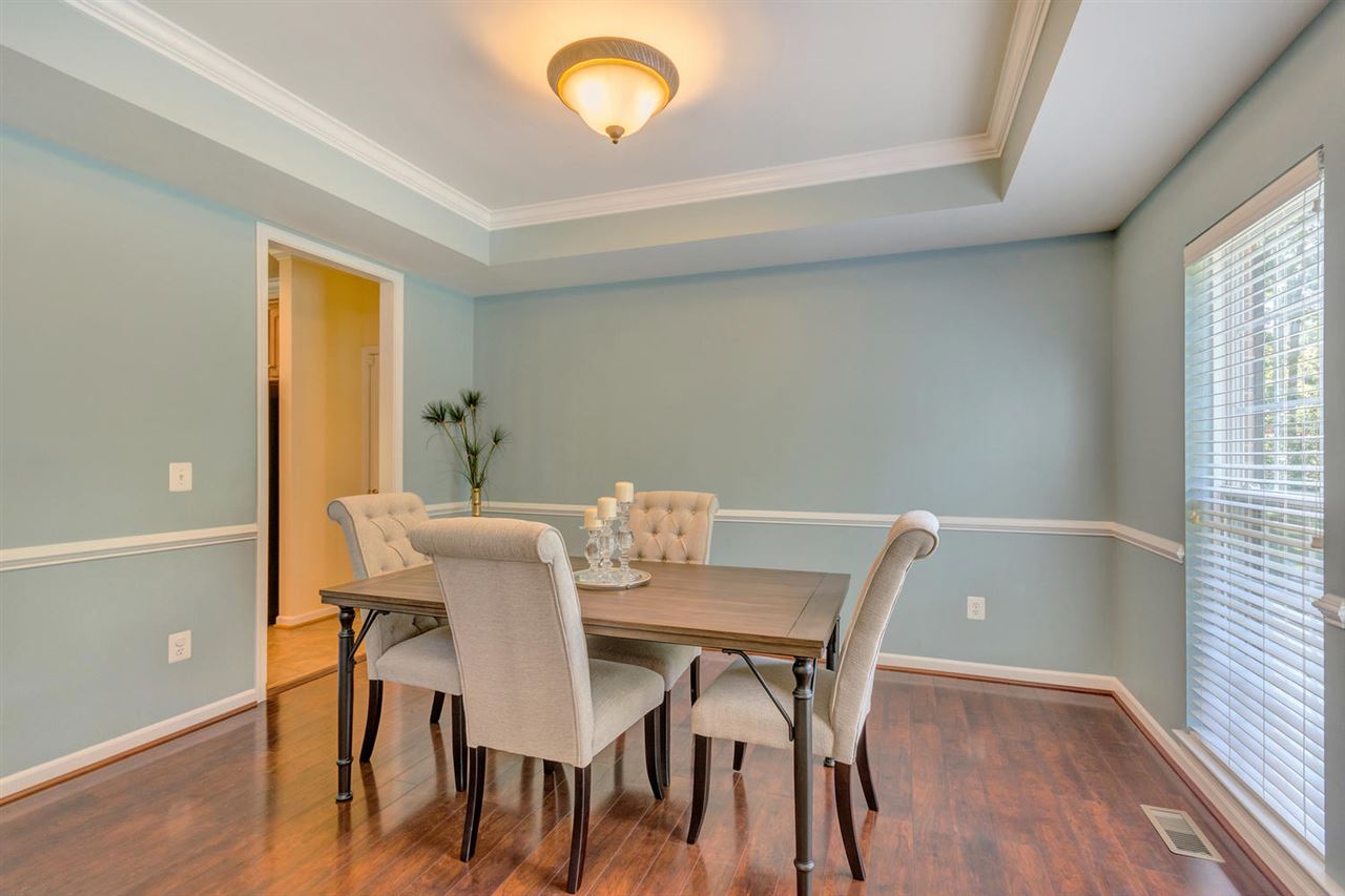 750 Reedy Creek Road Louisa, VA 23093 - Photo 3 of 41 a view of a dining room with furniture and wooden floor