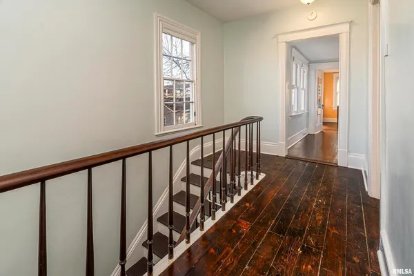 a view of a balcony with wooden floor