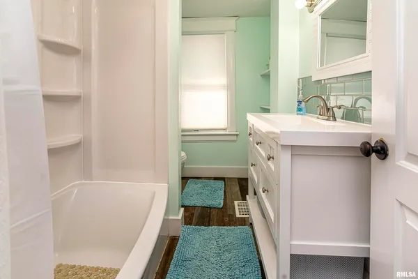a bathroom with a sink a toilet and a bathtub