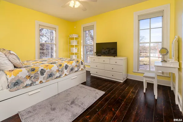 a living room with furniture and flat screen tv