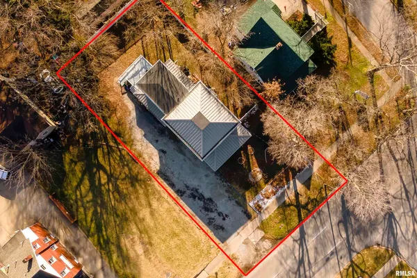 a aerial view of a house with a yard