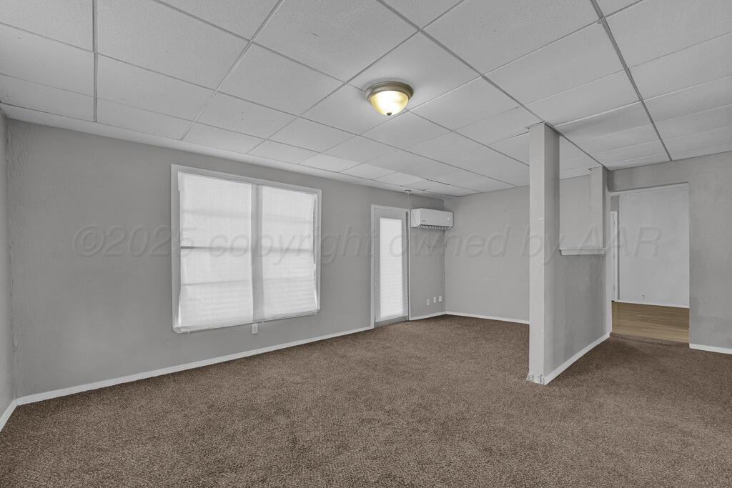 4006 Southeast 13th Avenue Amarillo, TX 79104 - Photo 3 of 16 an empty room with windows