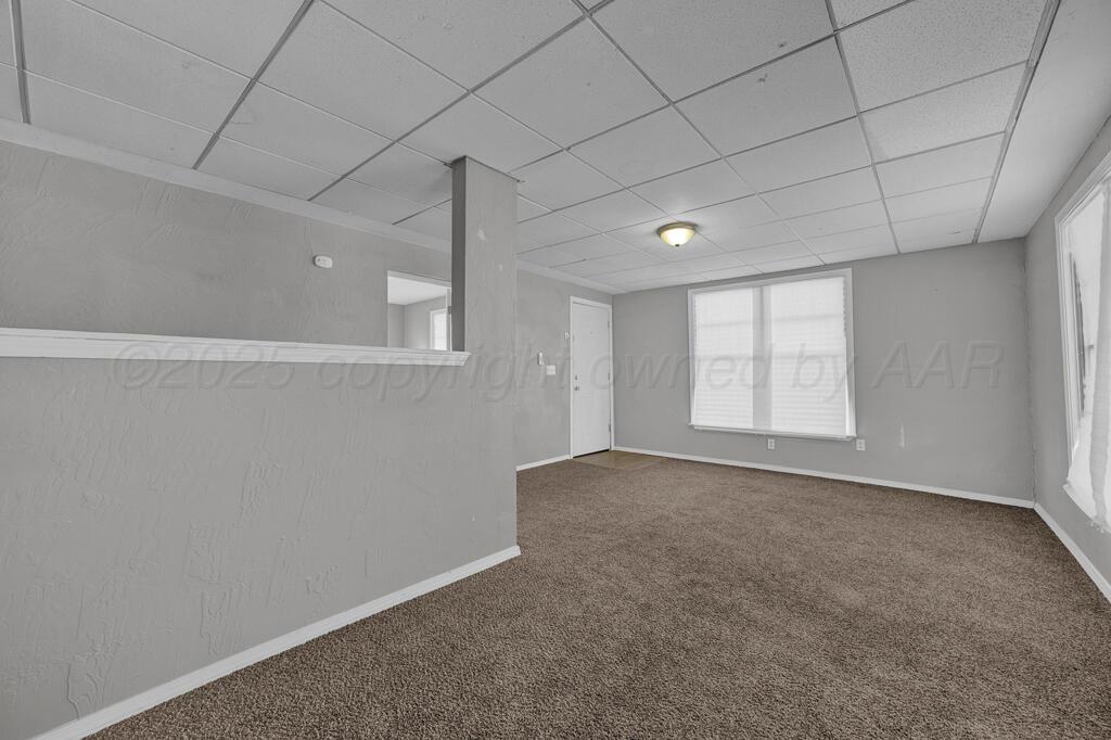 4006 Southeast 13th Avenue Amarillo, TX 79104 - Photo 5 of 16 an empty room with windows