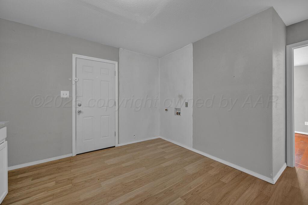 4006 Southeast 13th Avenue Amarillo, TX 79104 - Photo 8 of 16 a view of an empty room with wooden floor
