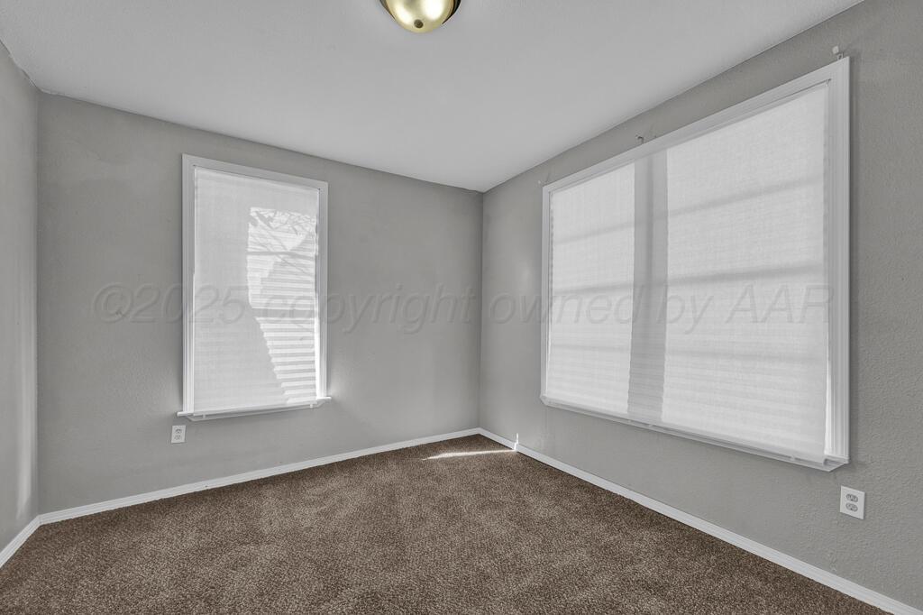 4006 Southeast 13th Avenue Amarillo, TX 79104 - Photo 9 of 16 an empty room with windows
