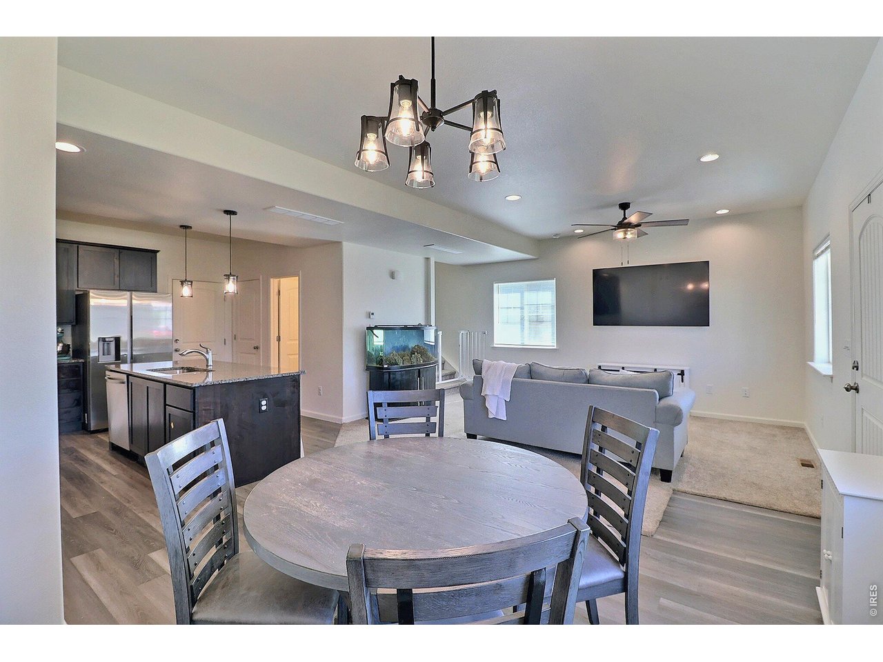 4355 24th Street Road, Unit 3204 Greeley, CO 80634 - Photo 9 of 34 Laminate Flooring in the Dining Room and Kitchen