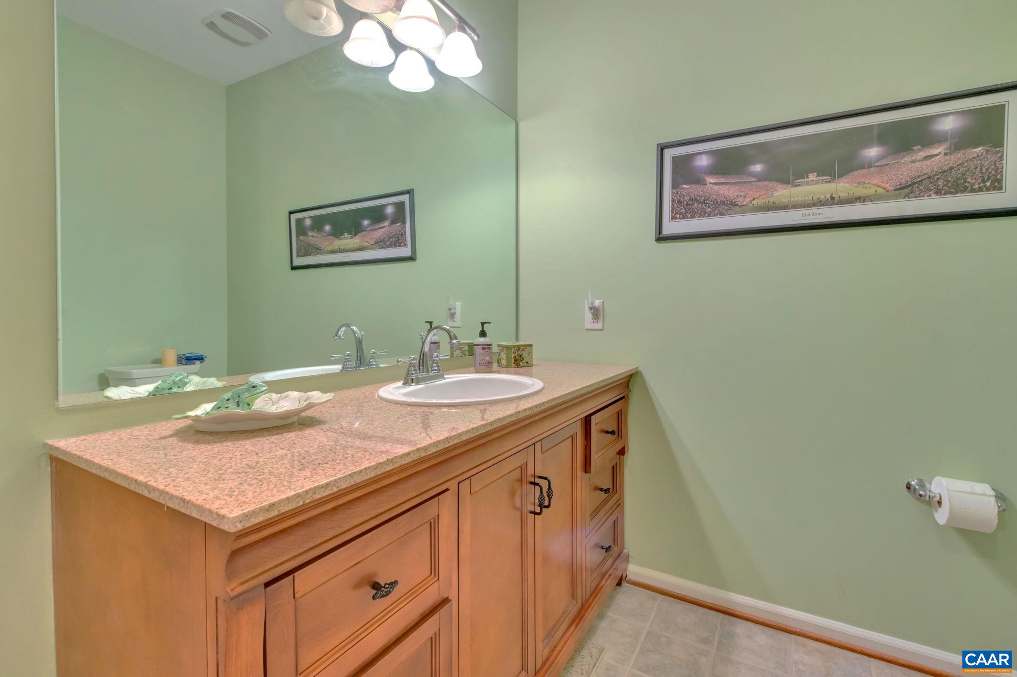 765 Walker Square, Unit 2D Charlottesville, VA 22903 - Photo 17 of 33 a bathroom with a sink and a mirror