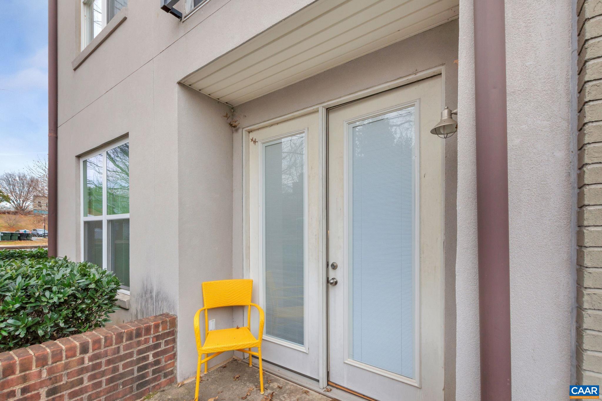 765 Walker Square, Unit 2D Charlottesville, VA 22903 - Photo 19 of 33 a house that has a wooden floor and a table