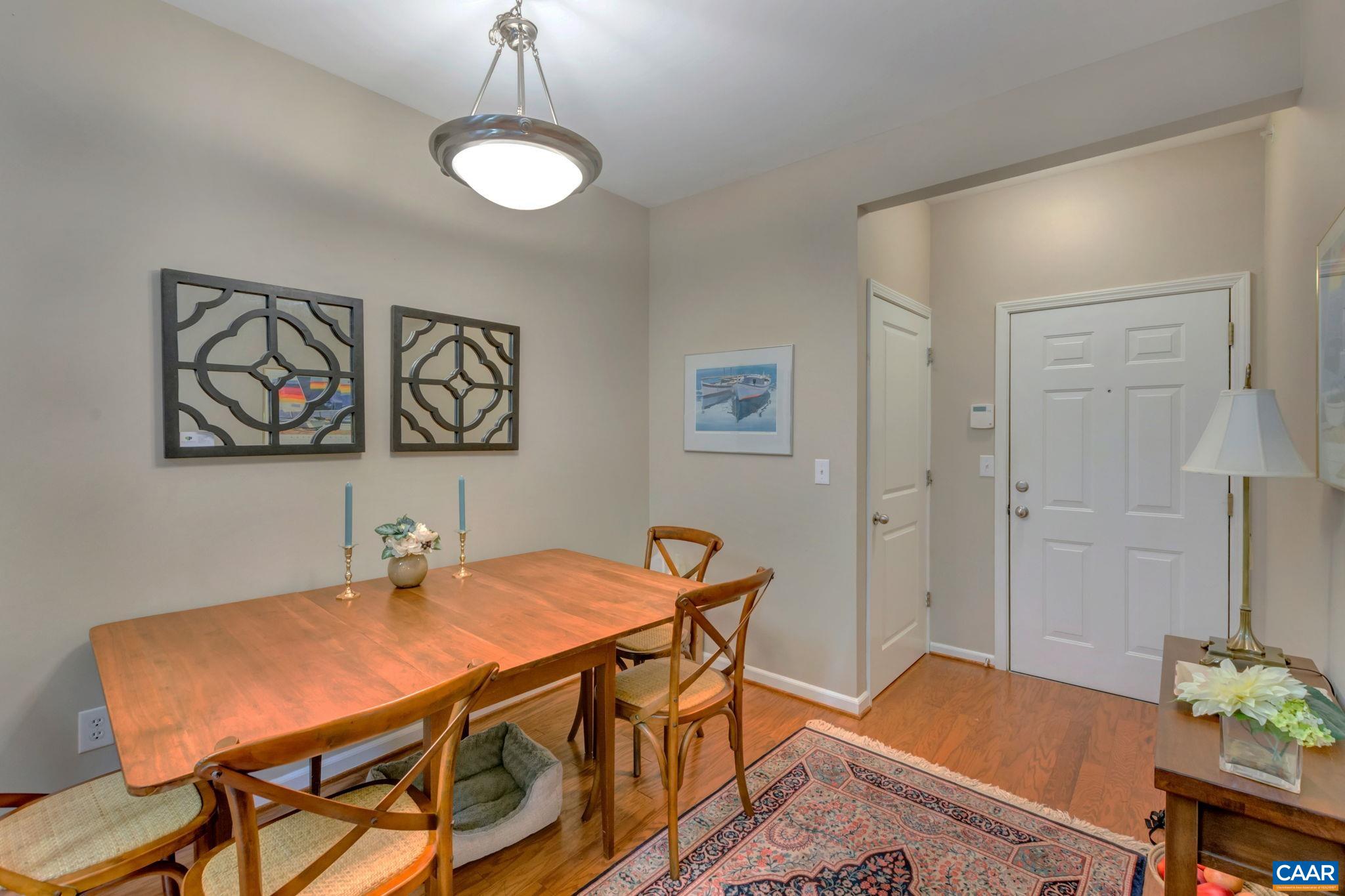 765 Walker Square, Unit 2D Charlottesville, VA 22903 - Photo 3 of 33 a view of a dining room with furniture and wooden floor