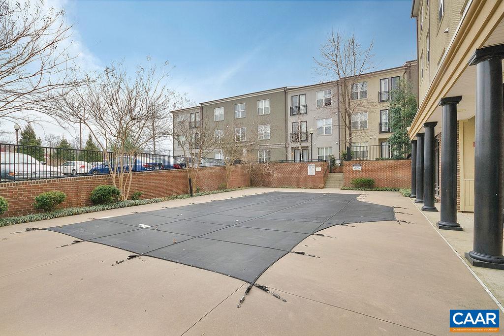 765 Walker Square, Unit 2D Charlottesville, VA 22903 - Photo 33 of 33 a view of a building with outdoor space and tree in beside