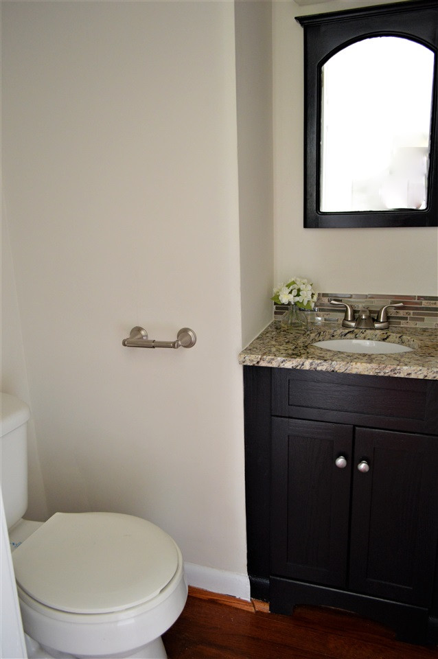 709 Friar Tuck Road Raleigh, NC 27610 - Photo 20 of 30 Powder room has new granite counter, undermount sink, and new light. Powder Room