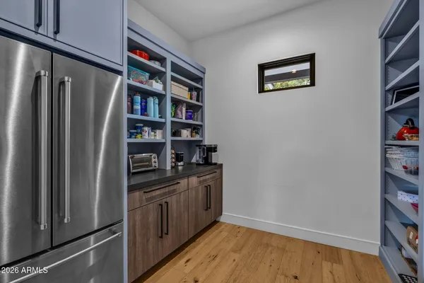 a kitchen with stainless steel appliances a sink stove and refrigerator