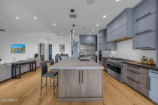 a living room with a stove and a mirror