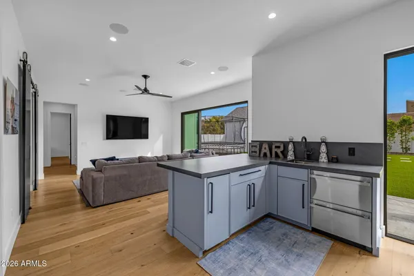 a living room with furniture and a large window