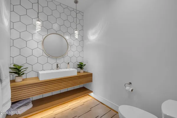 a bathroom with a toilet and sink