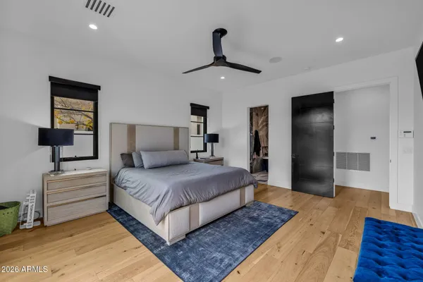 a kitchen with stainless steel appliances granite countertop a table chairs sink and cabinets