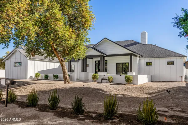 a kitchen with kitchen island a sink table and chairs