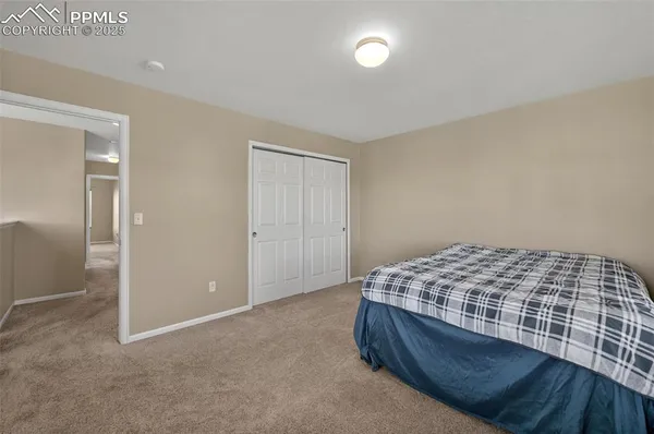 a bedroom with a bed and a cabinets