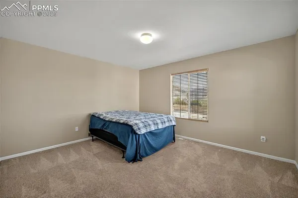 a room with a bed and a window