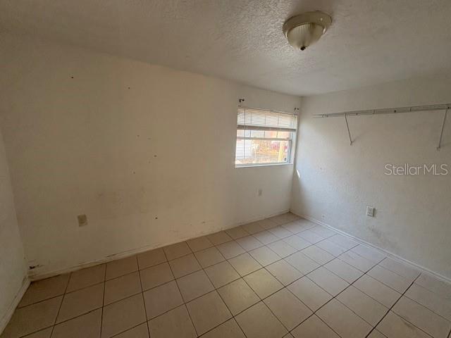 1672 10th Street Sarasota, FL 34236 - Photo 10 of 24 a view of an empty room with a window
