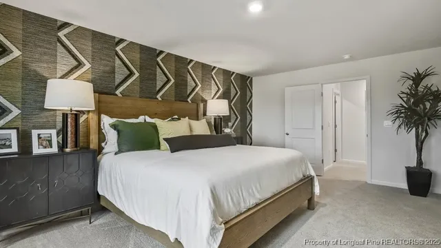 a bedroom with a bed and a potted plant