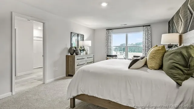 a bedroom with a bed and window