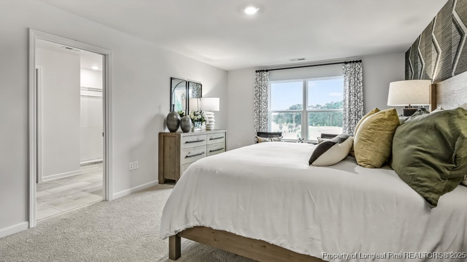 45 Mercer Way Spring Lake, NC 28390 - Photo 19 of 35 a bedroom with a bed and window